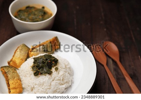 Cooked Milkfish and Moringa Leaf Soup served with White Rice Isolated Photo
