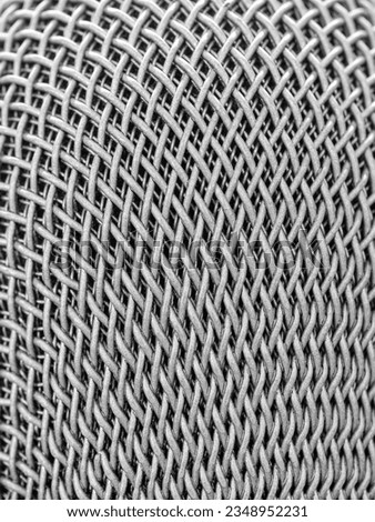 Steel grille background. Close-up shot of microphone , Selective focus