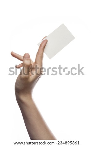 A female(woman) hand hold(pick up) a empty(blank) paper(business name card) isolated white at the studio.