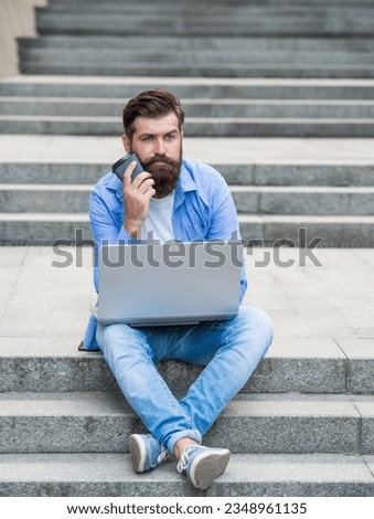 bored freelancer man has communication at coffee break. freelancer man has communication