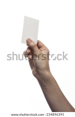 A female(woman) hand hold(pick up) a empty(blank) paper(business name card) isolated white at the studio.