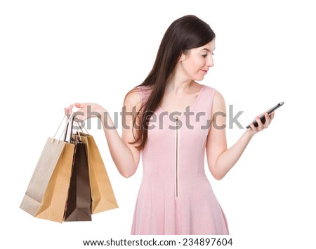 Woman shopping bag and look at cellphone
