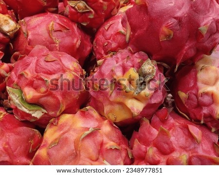 Red dragon fruit on display on a shelf in a supermarket in Indonesia. Nature concept, flat lay. Organic nutrition diet fruit.