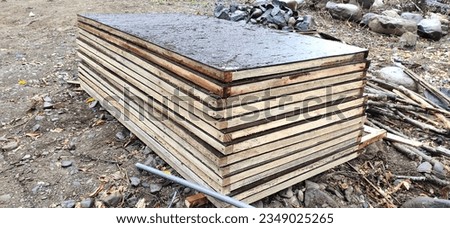 photo of formwork board for casting irrigation canal walls.