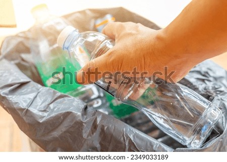 Hand hold old plastic bottles and containers set for recycling,Rubbish, rubbish, garbage, plastic waste, plastic waste pollution

