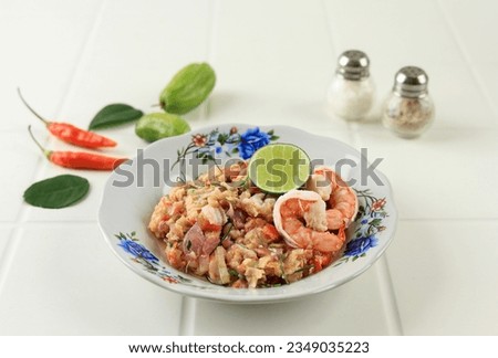 Shrimp Spicy Sauce with  Bilimbi Belimbing Wuluh, Chilli, and Lime. Sambal Ganja is Special Sauce Dish from Aceh, Indonesia Royalty-Free Stock Photo #2349035223