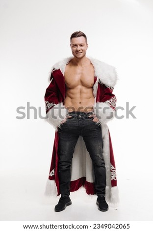 A man in a santa suit posing for a picture