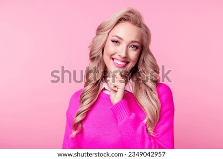 Photo of positive pretty girl wavy hairdo wear trendy clothes fingers touch face think creative idea isolated on pink color background