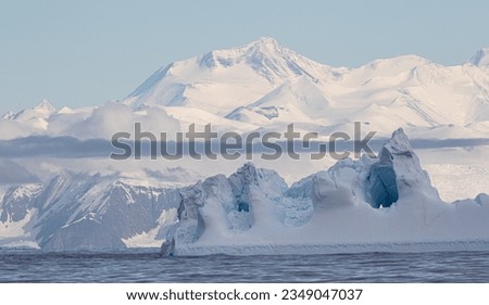 Blue cleft; Cape Ada, Clouds over icefields; Ross Sea, Antarctic are, Antarctica; Iceberg and mountain; Cape Adare, Antarctica Bay