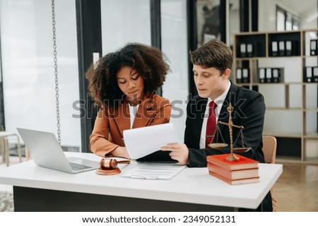  portrait of business people and lawyers discussing contract papers sitting at the table. Concepts of law, advice, legal services. in morning light
