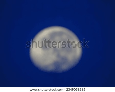 Defocused photo of the moon in the morning