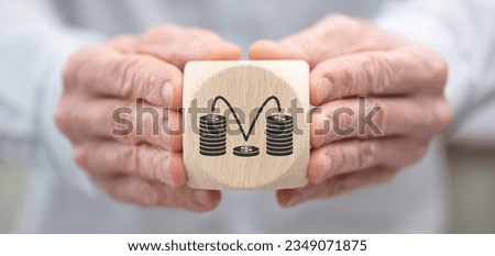 Hand holding a wooden cube with symbol of rebound concept