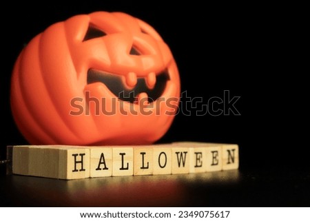 halloween 2023 concept on cubes and pumpkin