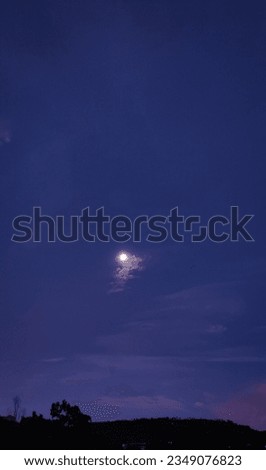 selective focus picture of moon in the sky