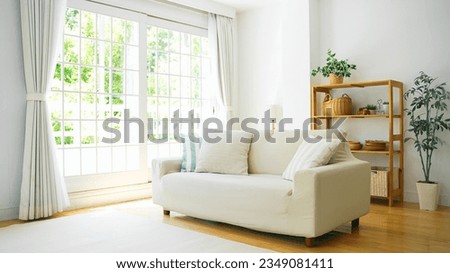 A comfortable living room with a sofa with a big window. Royalty-Free Stock Photo #2349081411