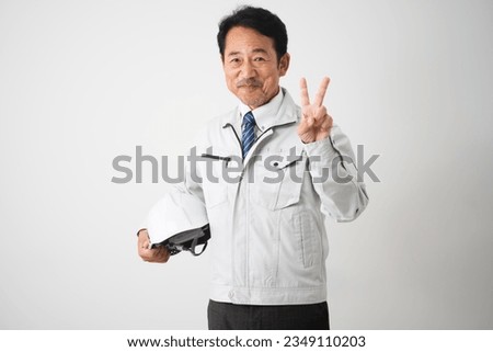 Image of work clothes for middle-aged men who make a peace sign