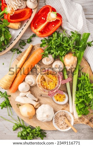 Homemade vegetable broth powder, organic vegetable stock, with raw vegetables, mushrooms and herbs