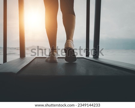 jogging on a treadmill In the evening when the sun shines through