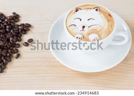 cute cat latte art coffee cup on a wooden table