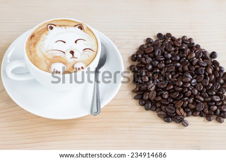 cute cat latte art coffee cup on a wooden table