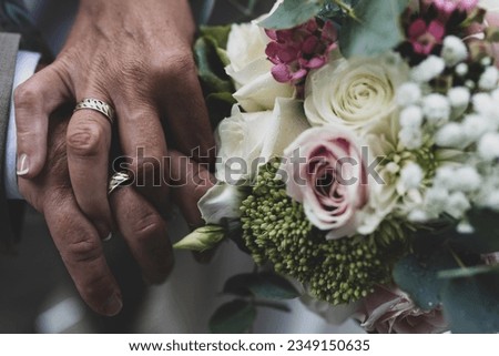 Wedding day. Celebrating love. Beautiful flowers and amazing wedding rings. Very special day. Royalty-Free Stock Photo #2349150635