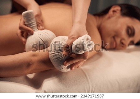 Beauty clinic client getting hot compress arm massage