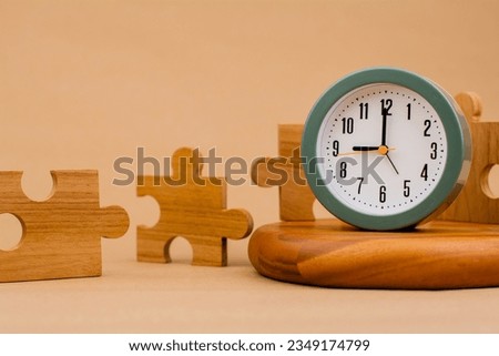 Clock and jigsaw puzzle pieces. Time lapse time. Wooden jigsaw puzzle pieces. communication teamwork key components