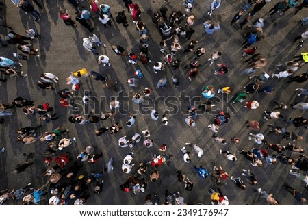 crowd background. An aerial shot of the people gathered for an event. Crowed open-air meeting people shot from a height. A mass people gathered to celebrate an event. Open-air night festival. Royalty-Free Stock Photo #2349176947