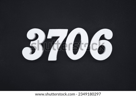 Black for the background. The number 3706 is made of white painted wood.
