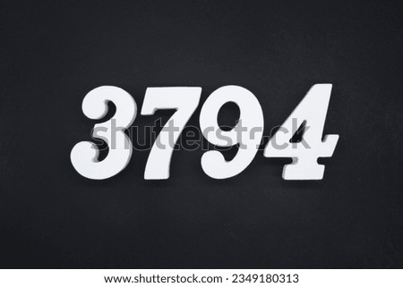 Black for the background. The number 3794 is made of white painted wood.