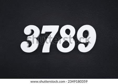 Black for the background. The number 3789 is made of white painted wood.