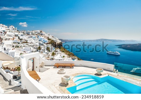 White architecture on Santorini island, Greece. Swimming pool in luxury hotel. Beautiful view on the sea Royalty-Free Stock Photo #234918859