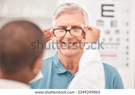 Optometrist, fitting glasses and senior man with smile, test and helping hand for healthy vision in retirement. Ophthalmologist, elderly patient and exam with lens, frame and wellness for eyesight Royalty-Free Stock Photo #2349249865