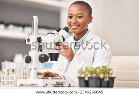 Science portrait, woman and plants, microscope or laboratory research for agriculture, sustainability and leaves test. Scientist, African student or happy doctor, lens and eco study or food security Royalty-Free Stock Photo #2349250045