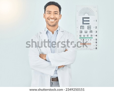 Ophthalmologist, portrait and man with arms crossed in hospital mockup space for healthcare of vision. Face, confident optometrist and happy doctor, Asian optician or medical professional in Cambodia Royalty-Free Stock Photo #2349250151