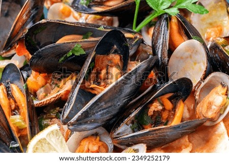 Typical italian Mussel and clam soup Royalty-Free Stock Photo #2349252179