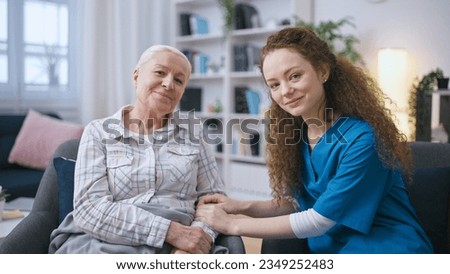 Female nurse holding hands of a senior woman, support and care for elderly people Royalty-Free Stock Photo #2349252483