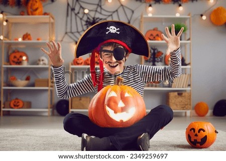 Portrait of little boy child dressed as pirate for all saints eve make scary face. Small kid in costume have fun threaten people at Halloween event celebration. Children fall carnival concept.