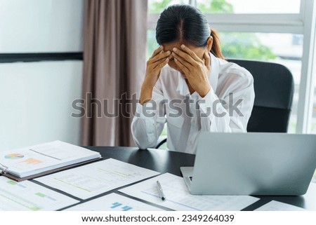 Burnout concept. Asian Business woman touching forehead having headache boring job and tired emotional pain and professional person depressed over risk. Royalty-Free Stock Photo #2349264039