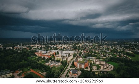 The city of Valmiera before the storm. The storm was approaching the city. Soft selective focus. An artificially created grainy picture