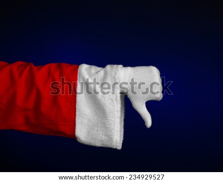 Santa Claus theme: Santa's hand showing gesture on a dark blue background
