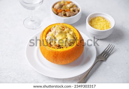 Pumpkin stuffed with chicken and carrots with celery. toning. selective focus