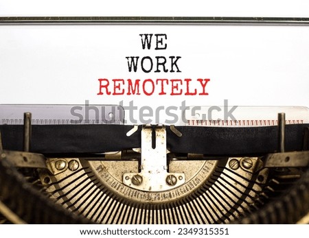 We work remotely symbol. Concept words We work remotely typed on beautiful retro old typewriter. Beautiful white background. Business we work remotely concept. Copy space.