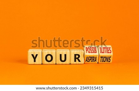 Your aspirations or possibilities symbol. Concept words Your aspirations or possibilities on wooden cubes. Beautiful orange background. Business Your aspirations or possibilities concept. Copy space. Royalty-Free Stock Photo #2349315415
