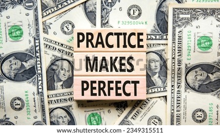 Practice makes perfect symbol. Concept words Practice makes perfect on wooden block. Dollar bills. Beautiful background from dollar bills. Business practice makes perfect concept. Copy space.