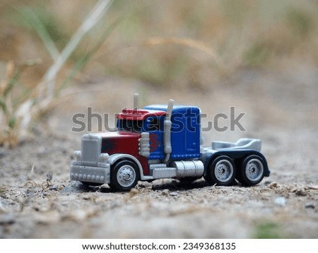 Toy photography concept. Unfocus view at outdoor. Background is blurred.