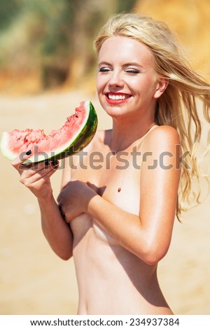 beautiful girl, blonde, holds a water-melon. summer time. Hipster Style