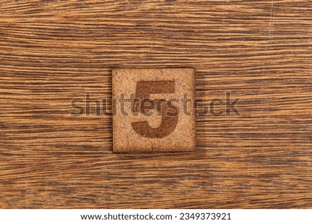 Number In Square Wooden Tiles - Number Five, On Wooden Background.
