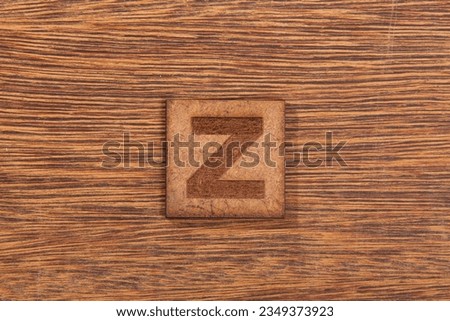 Capital Letter In Square Wooden Tiles - Letter Z, On Wooden Background.
