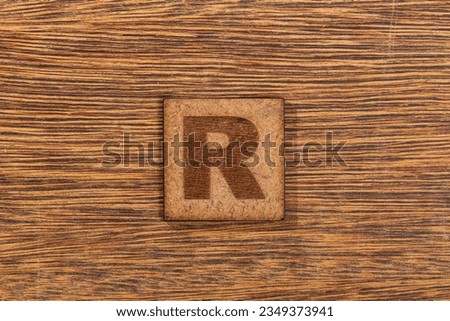 Capital Letter In Square Wooden Tiles - Letter R, On Wooden Background.